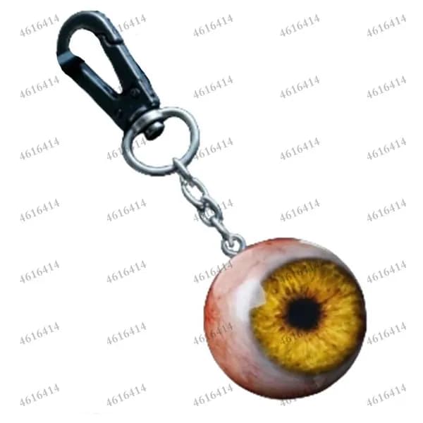 Фигурка глаза чудовища из смолы в золотом цвете с кольцом для ключей