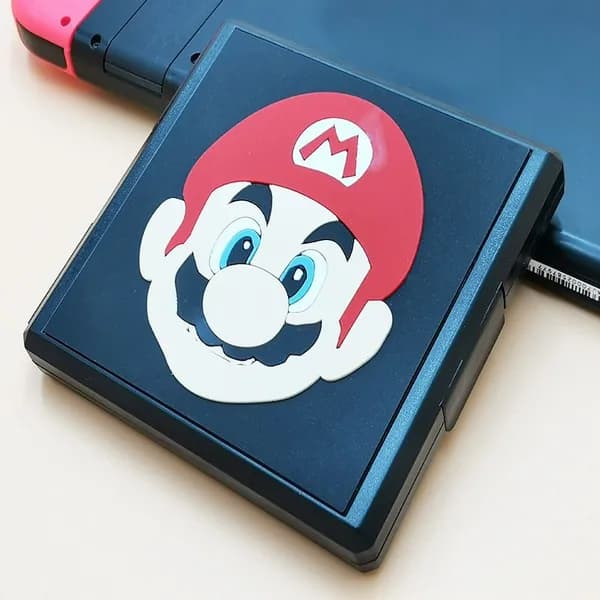 Эта стильная коробка для игровых картриджей Nintendo Switch 2 идеально подходит для безопасного хранения ваших любимых игр и карт памяти.