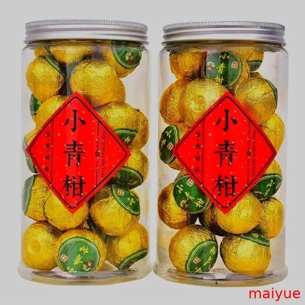 Чай пуэр с цитрусовым вкусом в виде маленьких зеленых мандаринов из Синьхуэя