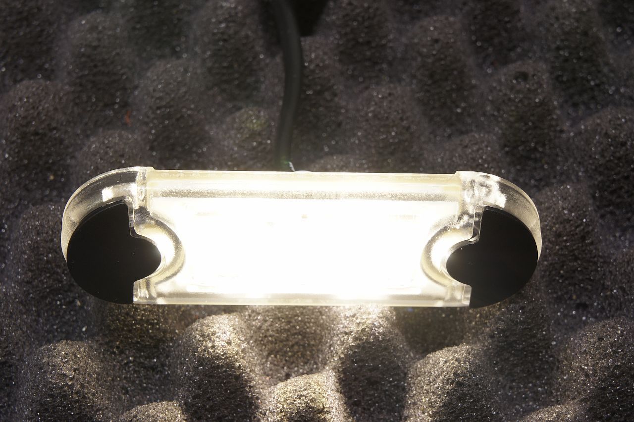 Фонарь габаритный белый LED 12V/24V 2PF959855201