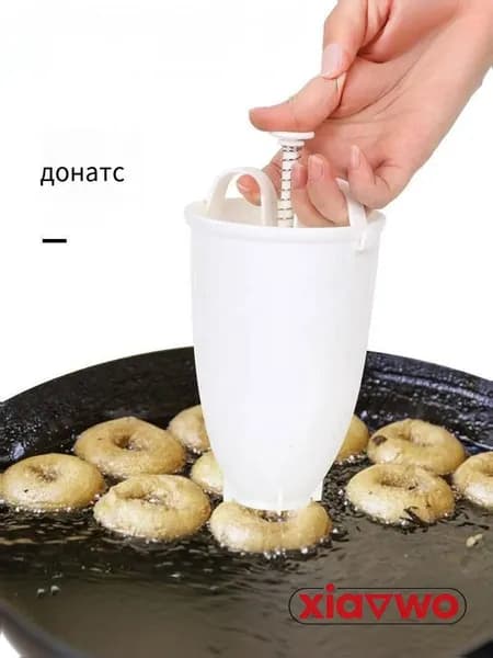Аппарат для пончиков аппарат для пончиков; электрическая пончиковница; мини-фабрика пончиков; автомат для жарки пончиков; прибор для выпечки пончиков;автоматический нагрев; антипригарное покрытие; регулировка температуры; таймер приготовления; съемные формы; компактный размер, белый