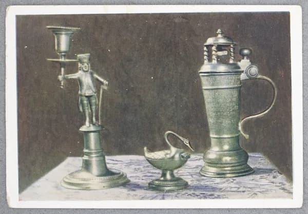 Открытка "Подсвечник с фигурой рудокопа Саксония Середина XIX в. Коробка для булавок в виде лебедя Германия ок. 1800 г. Кружка с изображением ремесленника Германия 1707 г" Чистая. 1956 г. СССР